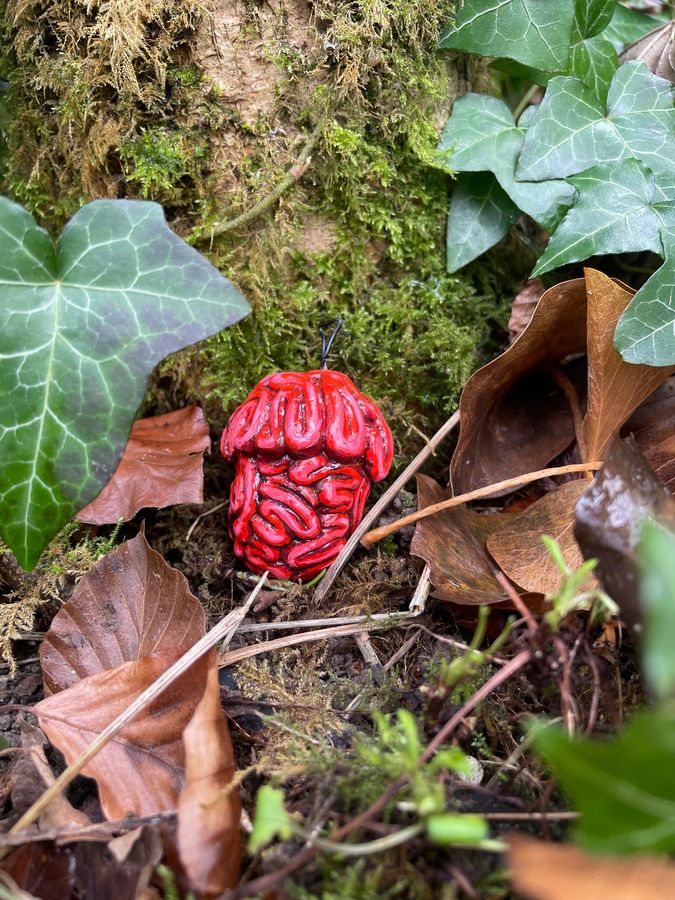 ‘Due Today: Eco-consciousness’, clay sculpture among ivy