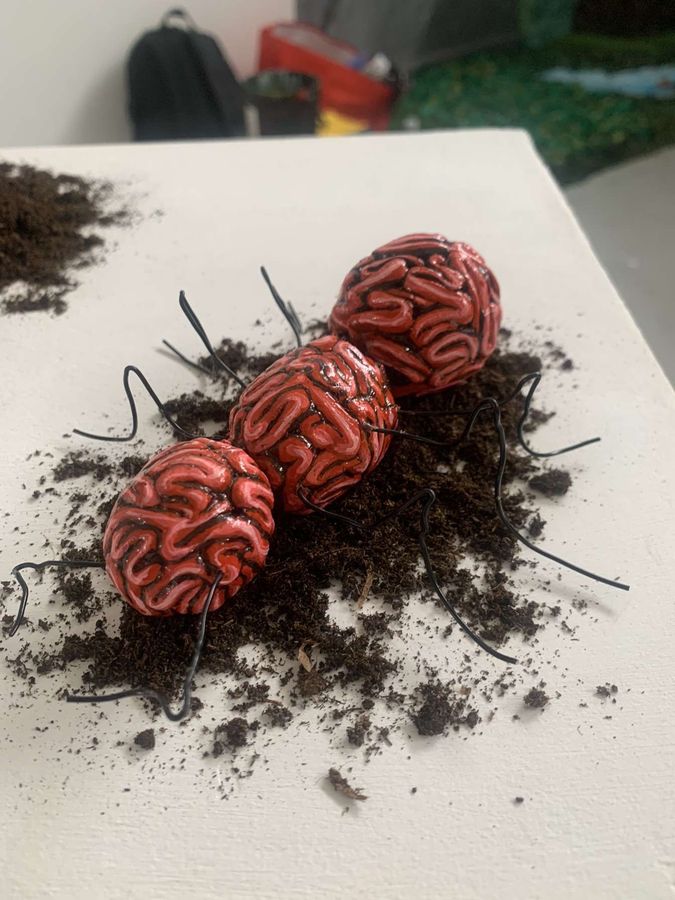 ‘Due Today: Eco-consciousness’, clay sculpture among ivy